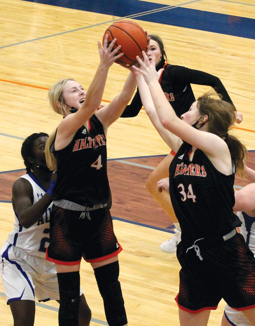Hillsboro's Sierra Compton (#4) and Alex Frailey (#34) both go up for a rebound during the Toppers' game against Auburn on Thursday, Dec. 30. Frailey would have 14 points and eight rebounds in Hillsboro's 42-30 win over the Trojans, which gave them fifth place in the 16-team Riverton Christmas Classic.